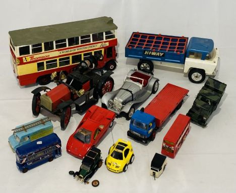 A collection of unboxed toy and model vehicles including a Tri-ang Hi-Way tipper truck, limited edition of Ipswich model fire