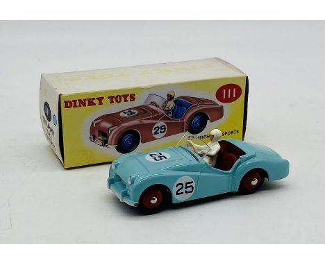 A boxed Mattel Dinky Toys Triumph TR2 Sports die-cast car - box faded