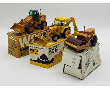 A boxed NZG Case W20C Wheeled Loader (1:35 scale), along with boxed Conrad Massey Ferguson 50B digger (wheel broken) and boxe