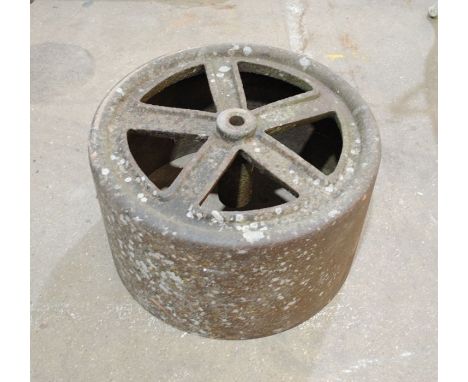 A weathered cast iron garden roller
