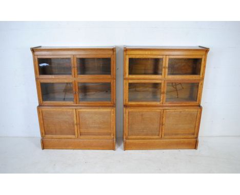 A pair of 'The "Oxford" sectional bookcases' by 'W. M. Baker &amp; Co Ltd' - length 88cm, depth 32cm, height 119cm 