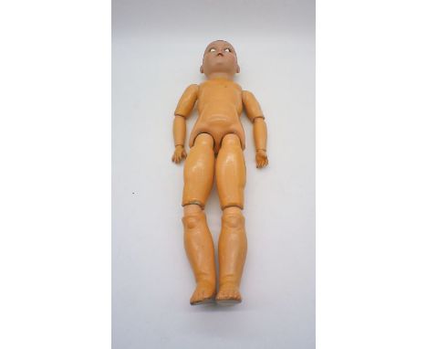 A Heinrich Handwerck doll, china head with articulated body, eyes are loose but are enclosed. Stamped to back of head H.W. Ge