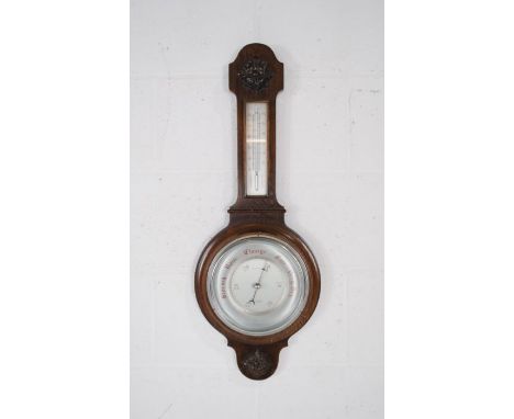 An oak banjo barometer with carved detailing - height 76cm