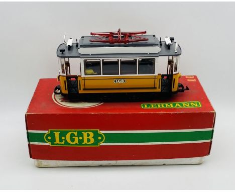 A boxed Lehmann L.G.B. G scale four wheeled tram/street car in yellow and white with passengers (No.2035)