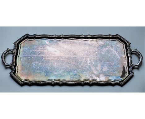 A twin handled rectangular silver tray, by Walker &amp; Hall, Sheffield 1967, with stepped scroll border, length 60.5cm. (app