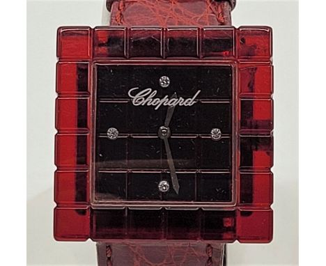 A Chopard "Be Mad" ladies' resin quartz wristwatch, having signed square burgundy dial with four diamond set hour markers, 31