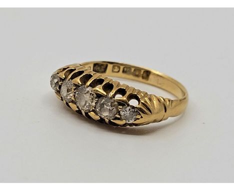 A Edwardian 18ct. yellow gold five stone diamond ring,&nbsp;London 1904, set five graduated old-cut diamonds, size UK M. (gro