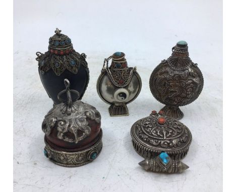 A collection of three Sino-Tibetan white metal snuff bottles together with a Sino-Tibetan pill box and similar (5)