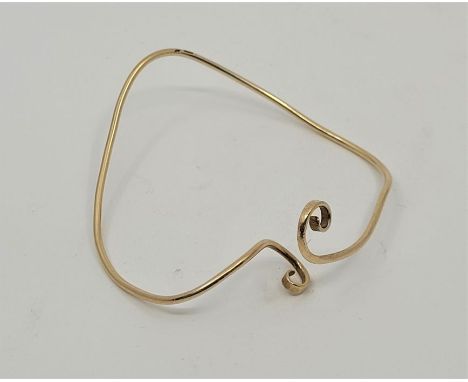 A 9ct. gold cuff bangle, as found. (10.2g)