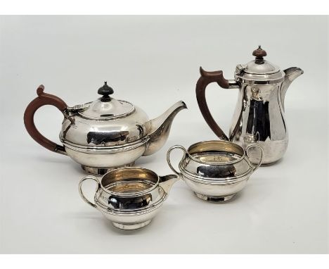 A three piece silver tea service, all by S W Smith &amp; Co, the teapot London 1912, the jug and twin handled sugar Birmingha