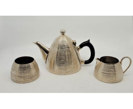 A silver plated three piece "bee hive" tea service. (3)