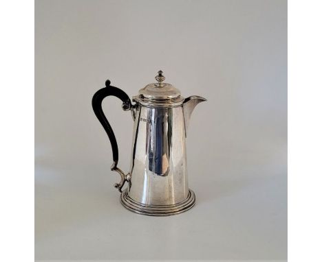 A silver hot water jug, by Martin Hall &amp; Co Ltd, Sheffield 1912, with ebony handle, (gross weight 569.2g/18.3Toz.)