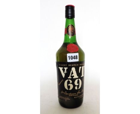 An old bottle of VAT 69 Finest Scotch Whisky by Wm Sanderson & Son ltd 70 proof 26 2/3 fl ozs (circa 1970's) 