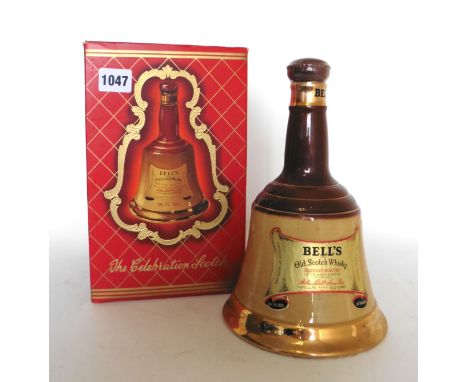 An old Bell's Celebration Scotch Bell decanter by Wade with box (circa 1970's) 70 proof 26 2/3 fl ozs 