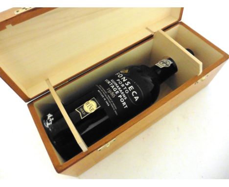 A bottle of Fonseca Guimaraens 1986 Vintage Port in presentation wooden box