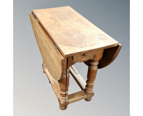 A 19th century oak gate leg occasional table. 