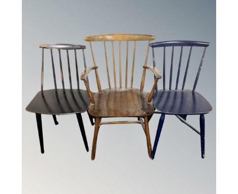 A 20th century Scandinavian stick back armchair together with two further stick back dining chairs. 