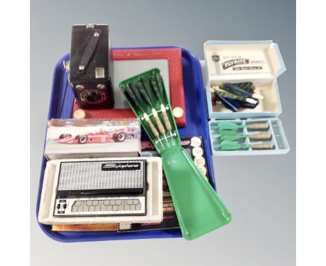 A tray containing stylophone, boxed camera, Etch A sketch, darts etc. 