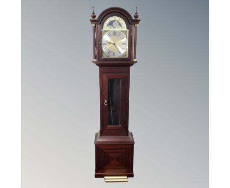 A contemporary moonphase longcase clock with pendulum and weights 