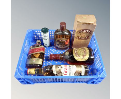 A box containing six bottles of alcohol to include Johnnie Walker Red Label, Grants Scotch Whisky, Laphraoig single malt mini