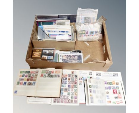 A box containing 20th century stamp albums containing world stamps, first day covers, post office mint stamps etc. 