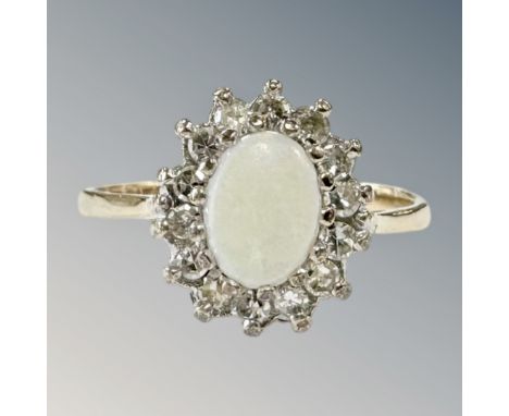 A 9ct yellow gold opal and diamond cluster ring, size O, 2.5g. CONDITION REPORT: 11.91 mm x 10.05 mm cluster dimensions. Shan