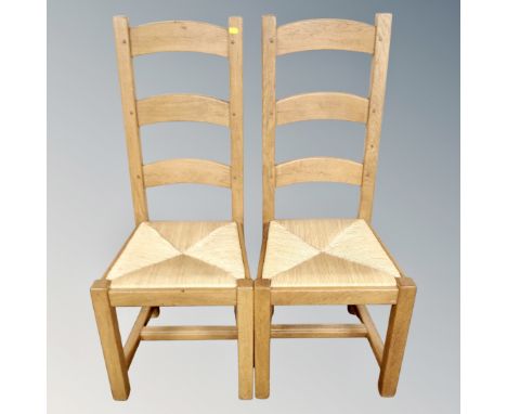 A set of six oak rush seated ladder back farmhouse chairs. 