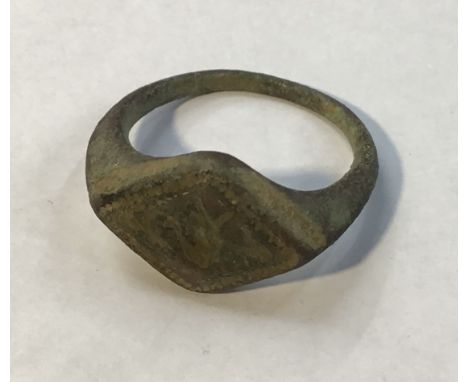Late Medieval Bronze Merchant Ring, Face engraved with double headed Swan, faint traces of gold leaf. Size W (uk) 11 (us)