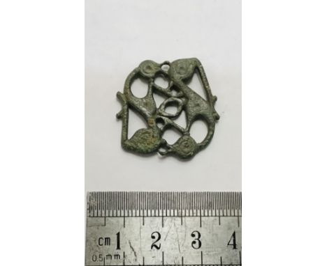                         Viking Mount. Circa 9th-10th century AD. Copper-alloy, 6.38 grams. 29.08 mm. A Viking mount depicting