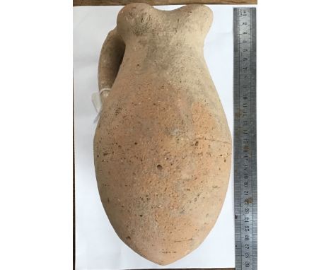                         A single handled terracotta wine Amphora dating from the 9th Century B.C. A plain but elegant vessel 