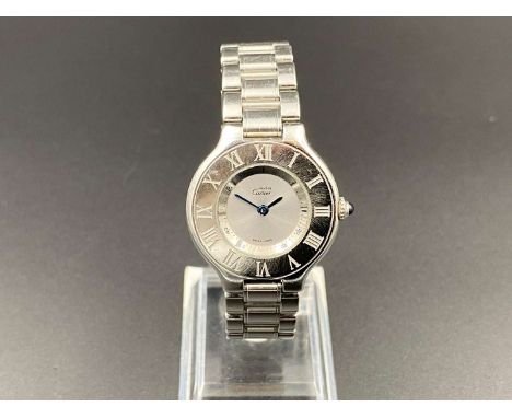         Summary:The quartz movement (unseen) to a signed and silvered dial with blued steel hands, in a brushed and polished 