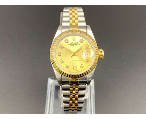         Summary:the jewelled automatic movement (unseen) to a gem set, gilt dial with baton hands and sweep centre seconds, i