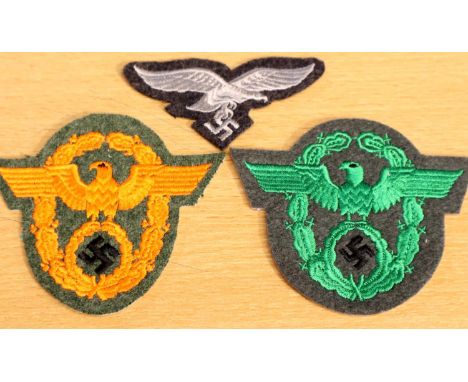 German WWII re-enactment embroidered NSFK orange and green uniform patches, and a Luftwaffe cap badge. P&amp;P Group 1 (£14+V