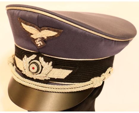 German Luftwaffe officers peaked cap, size 56 with silver braid, embroidered cockade and eagle, brand new with tags. P&amp;P 