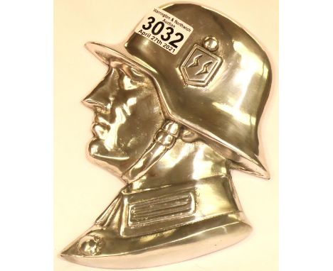 A polished metal SS soldiers side profile, wall or door mounting with threaded holes verso, H: 21 cm. P&amp;P Group 2 (£18+VA
