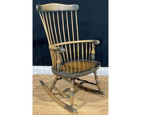 A beech comb-back rocking chair, 103cm high, 58cm wide 