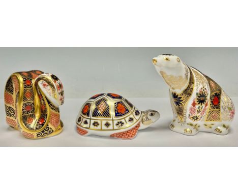 A Royal Crown Derby paperweight, Imari Polar Bear, printed in the 1128 palette, 11cm, gold stopper; others, Imari Snake, gold