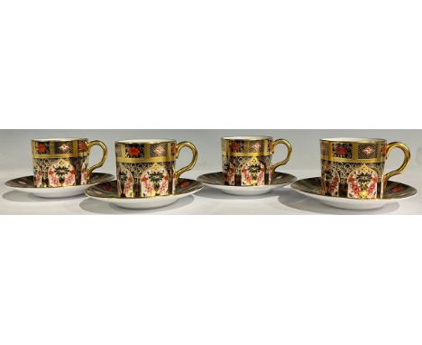 A set of four Royal Crown Derby 1128 Old Imari pattern coffee cans and stands, solid gold band, first quality (4) 