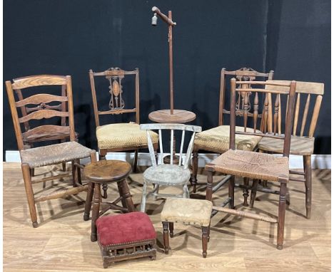 A 19th century child’s primitive stick back chair; vernacular side chairs; ash and elm milking stool; a pair of Edwardian sid