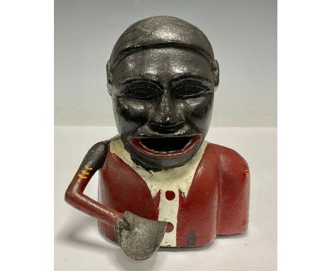 A hand operated cast iron money bank Notice from the the-saleroom.com: These items are listed on the basis they are illustrat