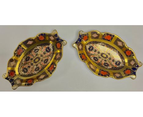 A pair of Royal Crown Derby Imari palette 1128 pattern oval trinket dishes, solid gold band, second quality, printed marks 