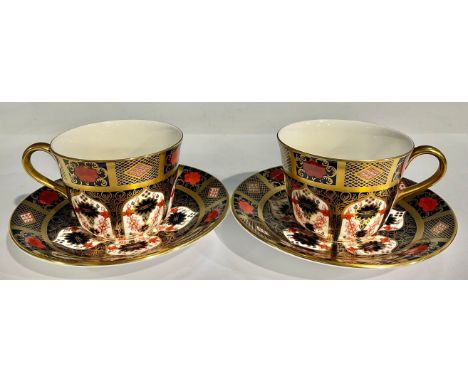 A pair of Royal Crown Derby 1128 Old Imari pattern teacups and saucers, solid gold band, first quality 