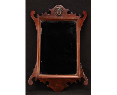 A George II Revival mahogany Vauxhall looking glass, rectangular mirror plate, shaped cresting applied with a maenad, 56cm x 