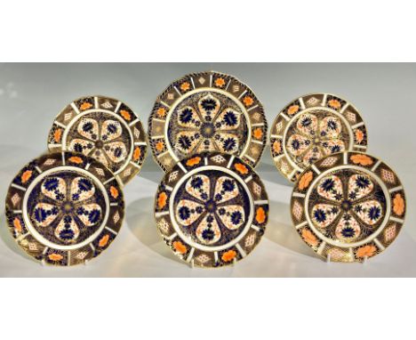 A Royal Crown Derby 1128 Old Imari pattern shaped circular plate, gadrooned border, 22.5cm diameter; a pair of 1128 Old Imari