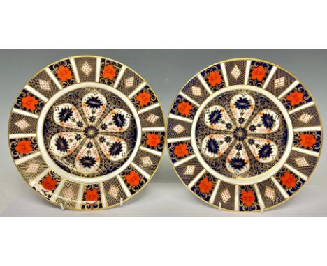 An associated pair of Royal Crown Derby 1128 Imari pattern dinner plates, 27cm diameter, second quality (2) 