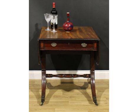 A 19th century mahogany sofa table, rounded rectangular top with fall leaves above a frieze drawer, blind to verso, turned st