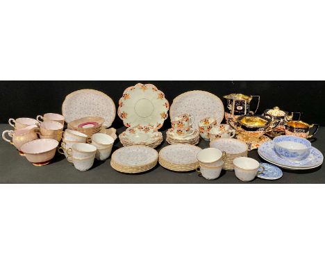 A Tuscan China tea service for six, comprising cake plate, side plates, cream jug, sugar bowl, cups and saucers; an Edwardian