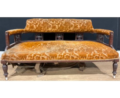 A late Victorian/Edwardian mahogany sofa, T. Edwards &amp; Sons, Wolverhampton, 76.5cm high, 148.5cm wide, the seat 58cm deep