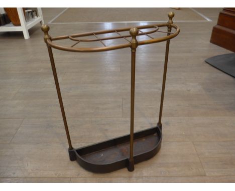 A 19th Century demi-lune brass and iron base stick stand with finial decoration, 47cm (w) x 61cm (h)