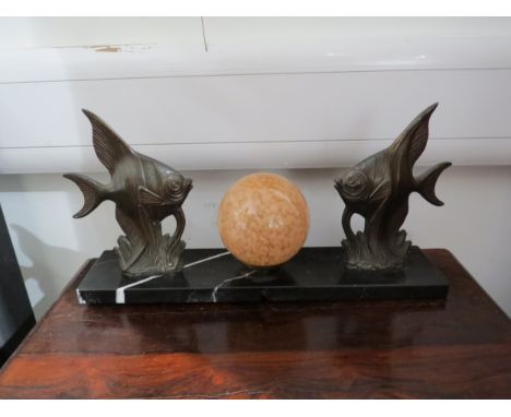 An Art Deco style mantel lamp, the central glass orb flanked by two angel fish, on figured black marble plinth base, 39.5cm l